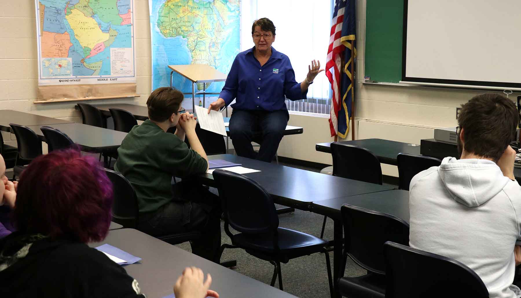 College instructor teaching in a classroom