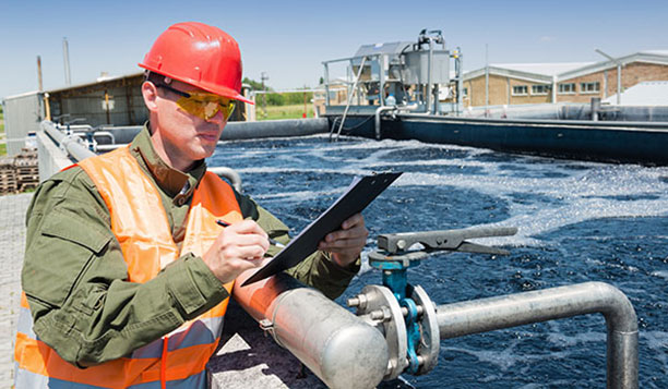 Worker at water treatment plant