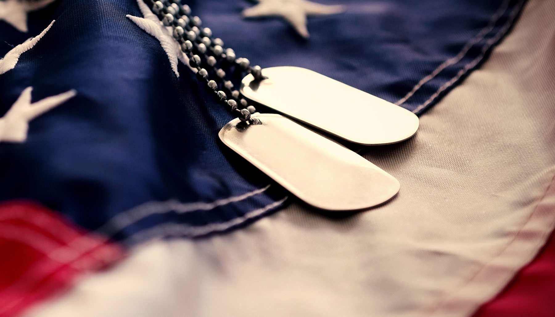 American flag with dog tags
